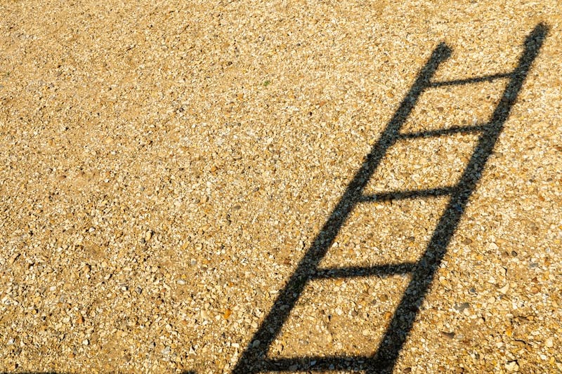 black metal frame on brown sand