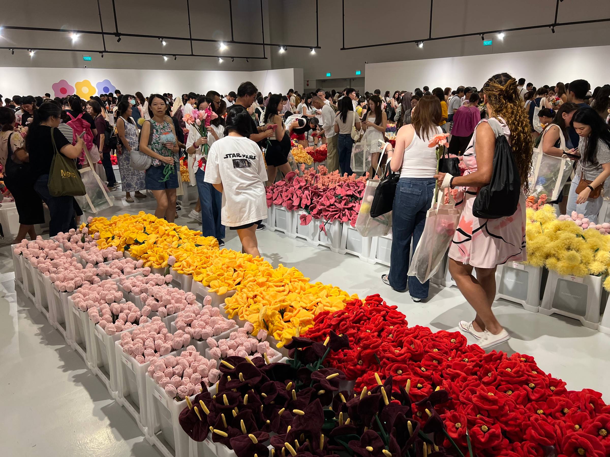 Crowds browsing plush flowers at CJ Hendry's Flower Market installation in Singapore