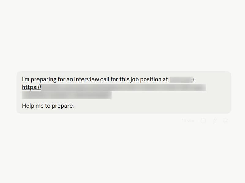 A Claude prompt that reads: "I'm preparing for an interview call for this job position at [redacted company name]: [redacted job description link]. Help me to prepare."
