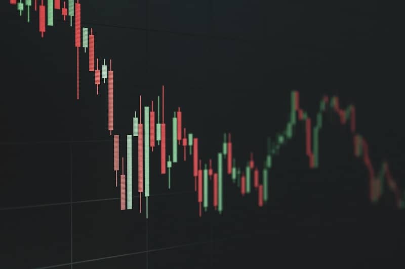 Stock market chart shows a declining trend.