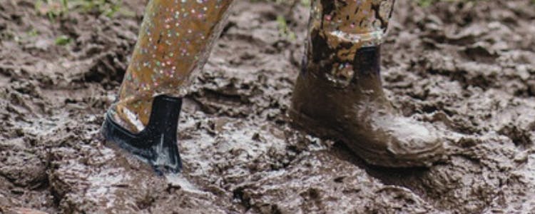 muddy boots in field