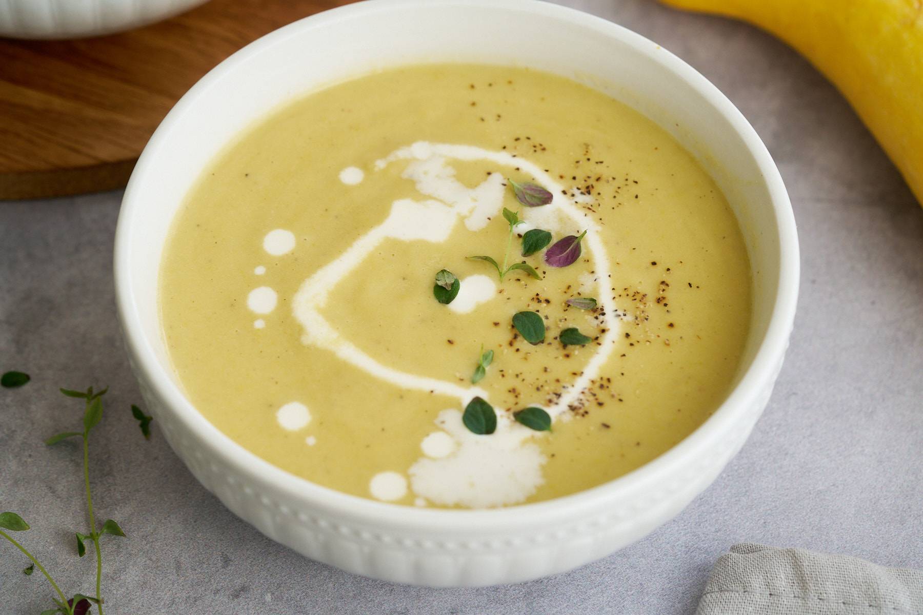 yellow squash soup in bowl
