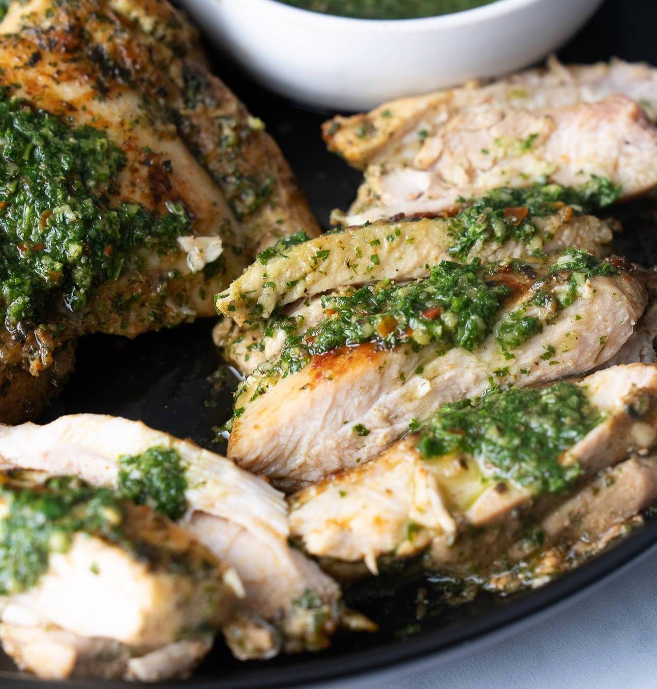 sliced chimichurri chicken on plate