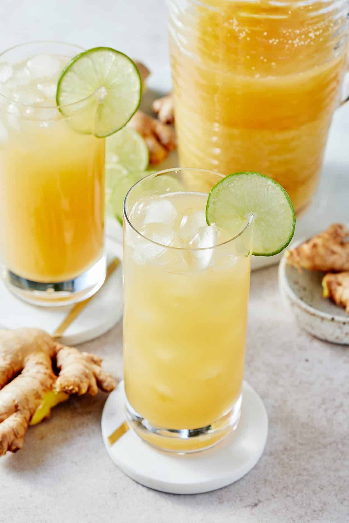 ginger beer in glass with lime slice on side