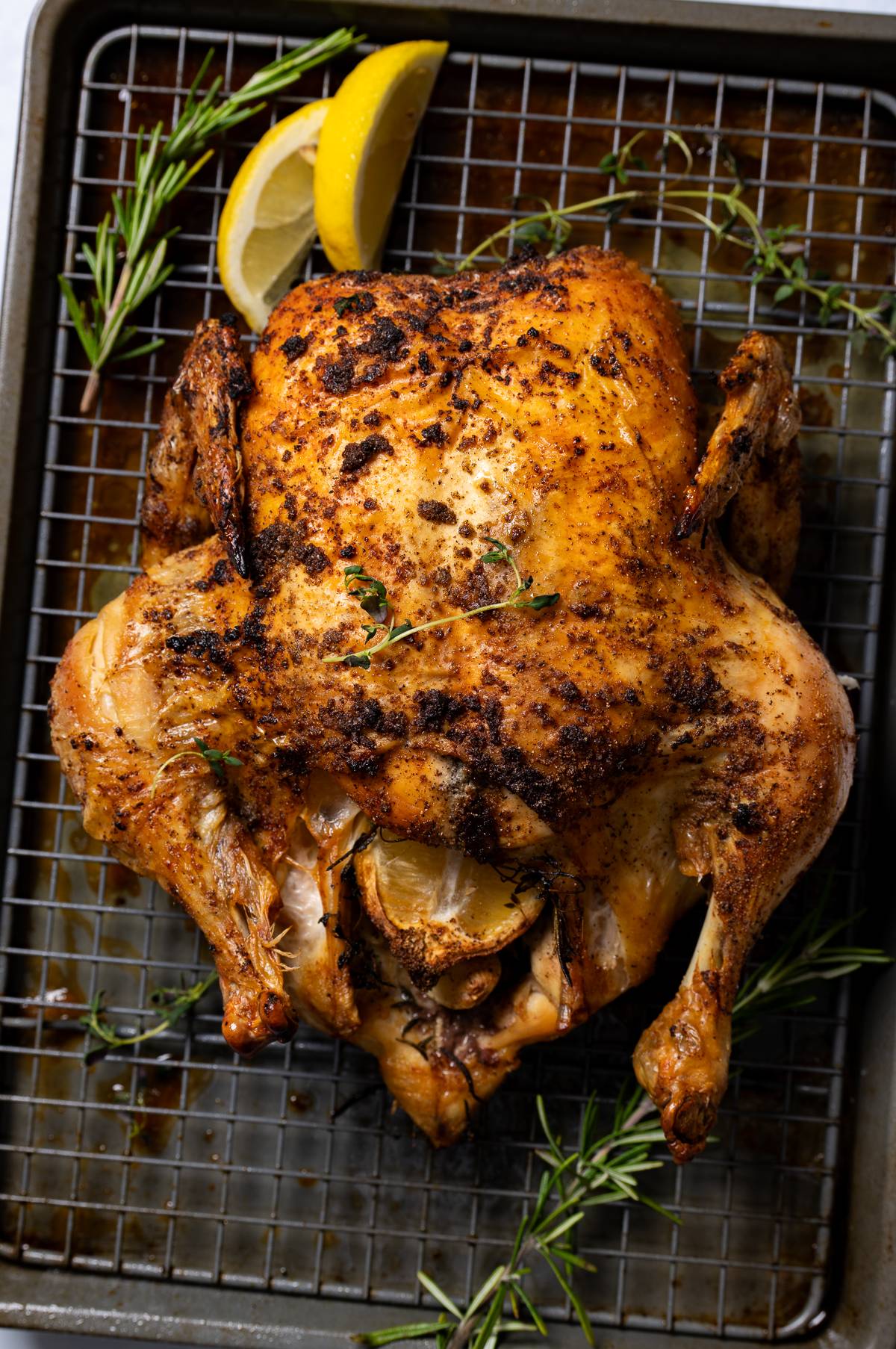 whole rasted chicken on baking pan