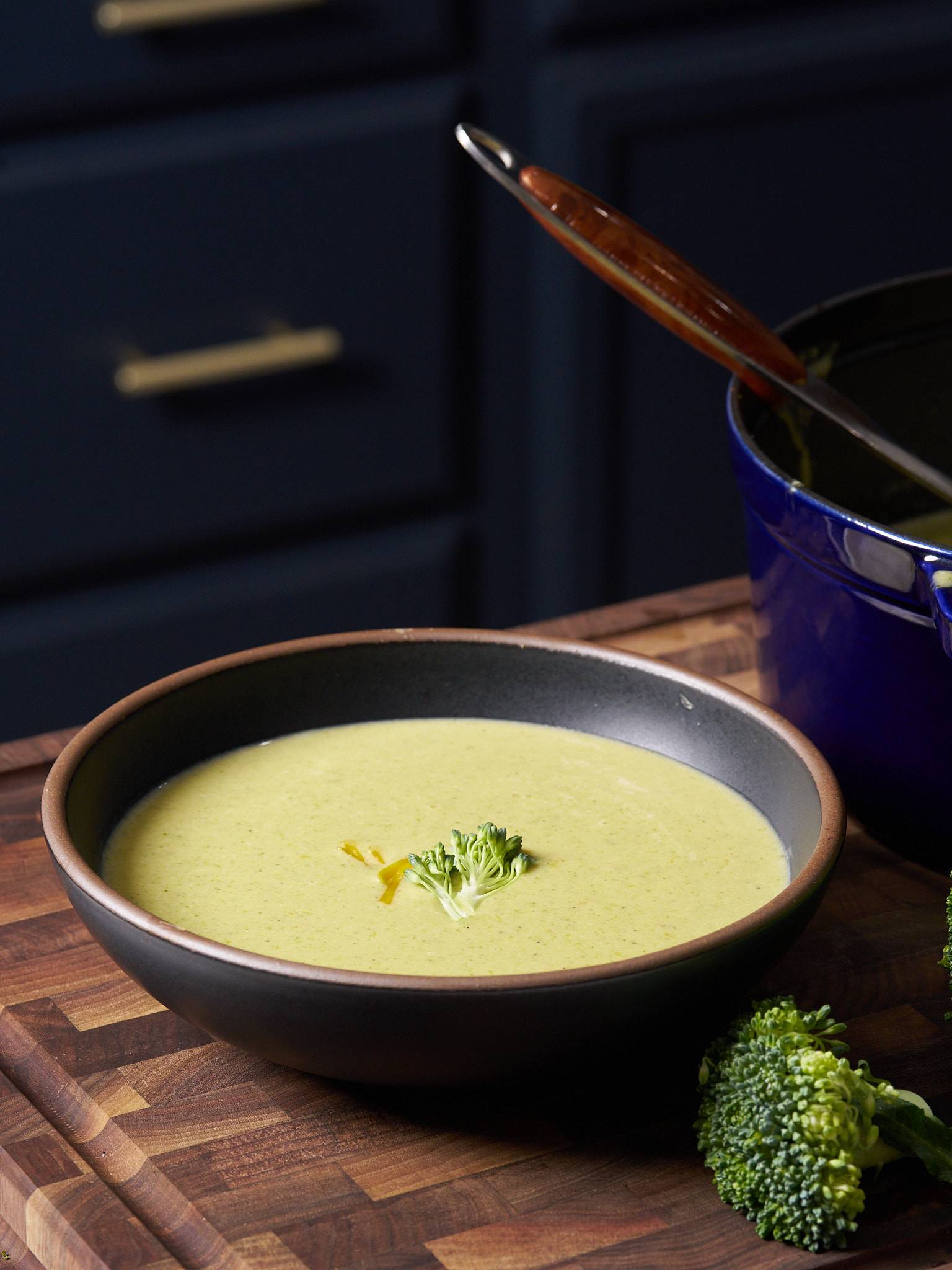 cream of broccoli soup in bowl in kitchen