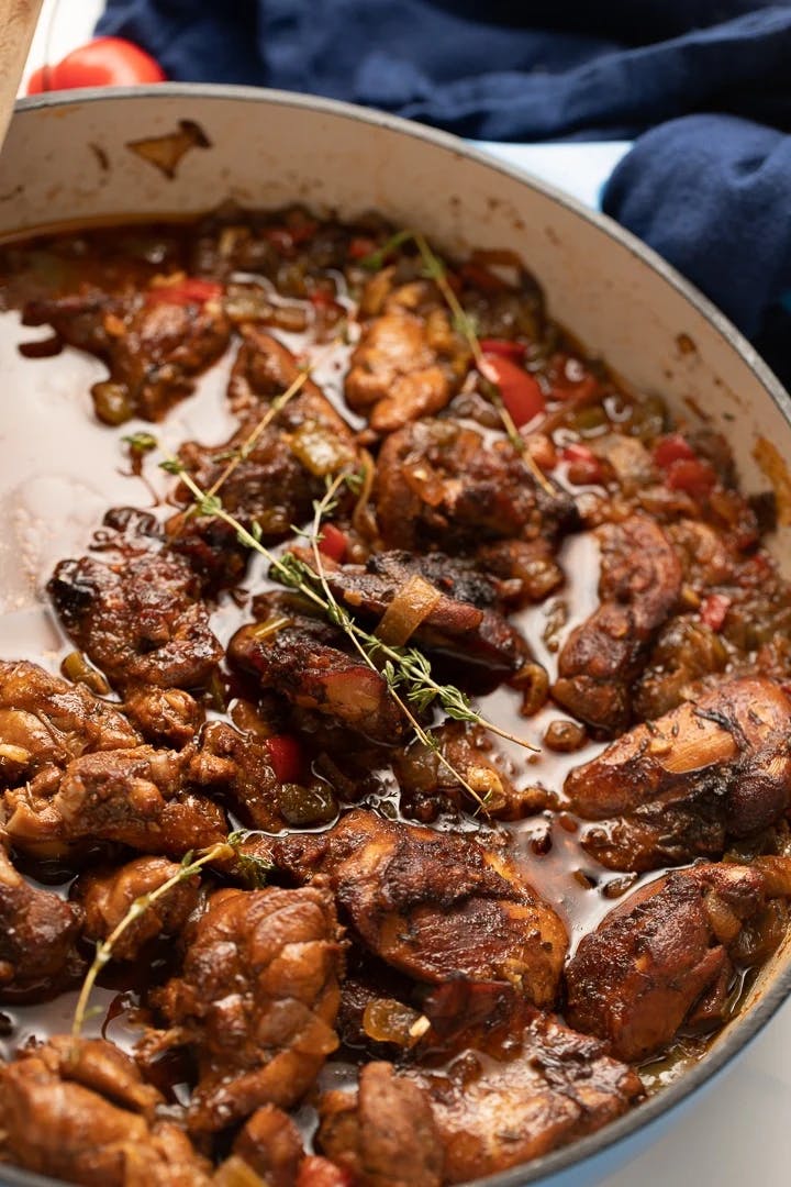 Brown stew chicken in pot