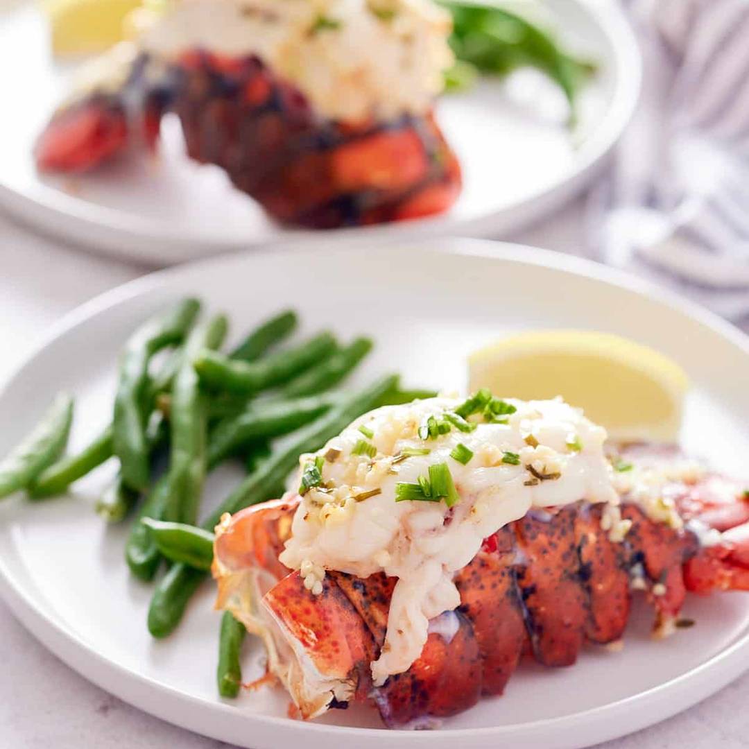 lobster on plate with green beans