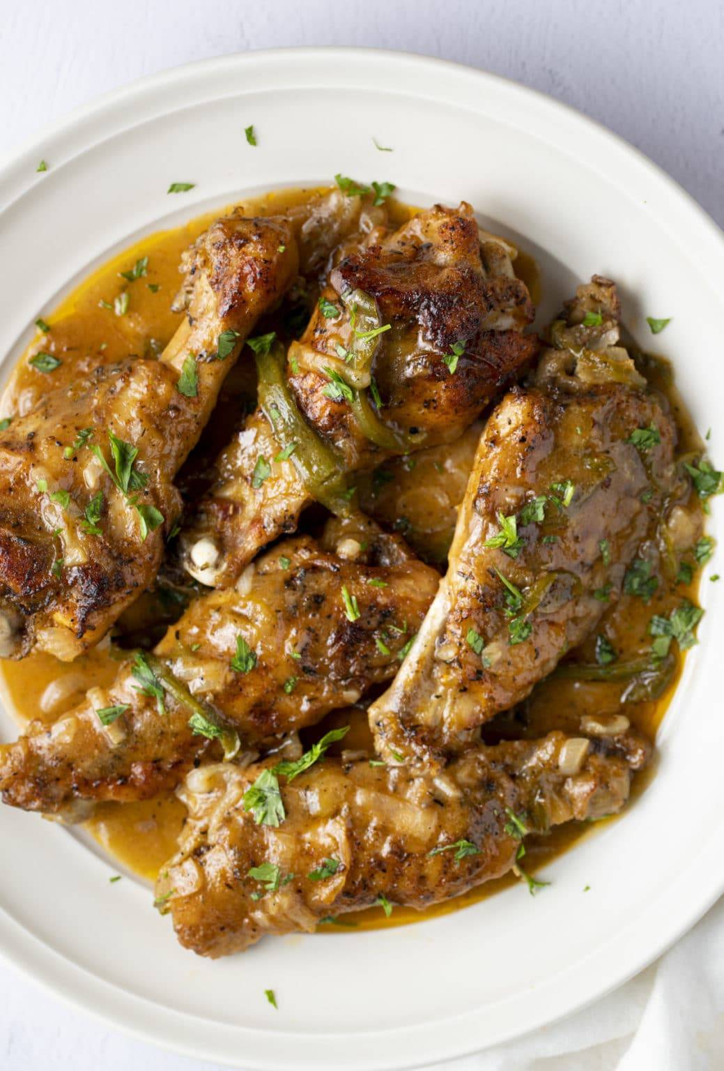 smothered turkey wings on white plate