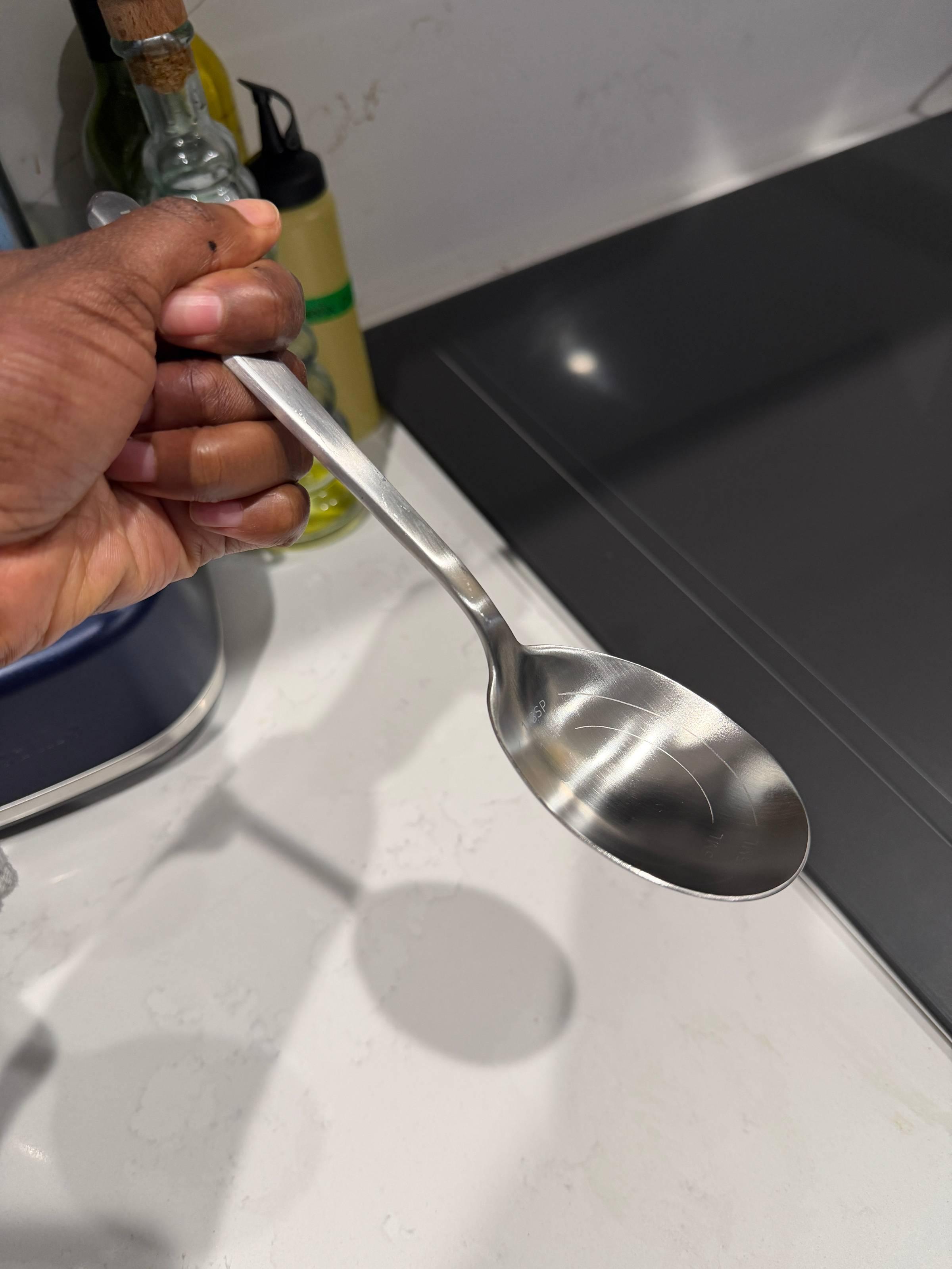 Deep chef's spoon with measurement markings