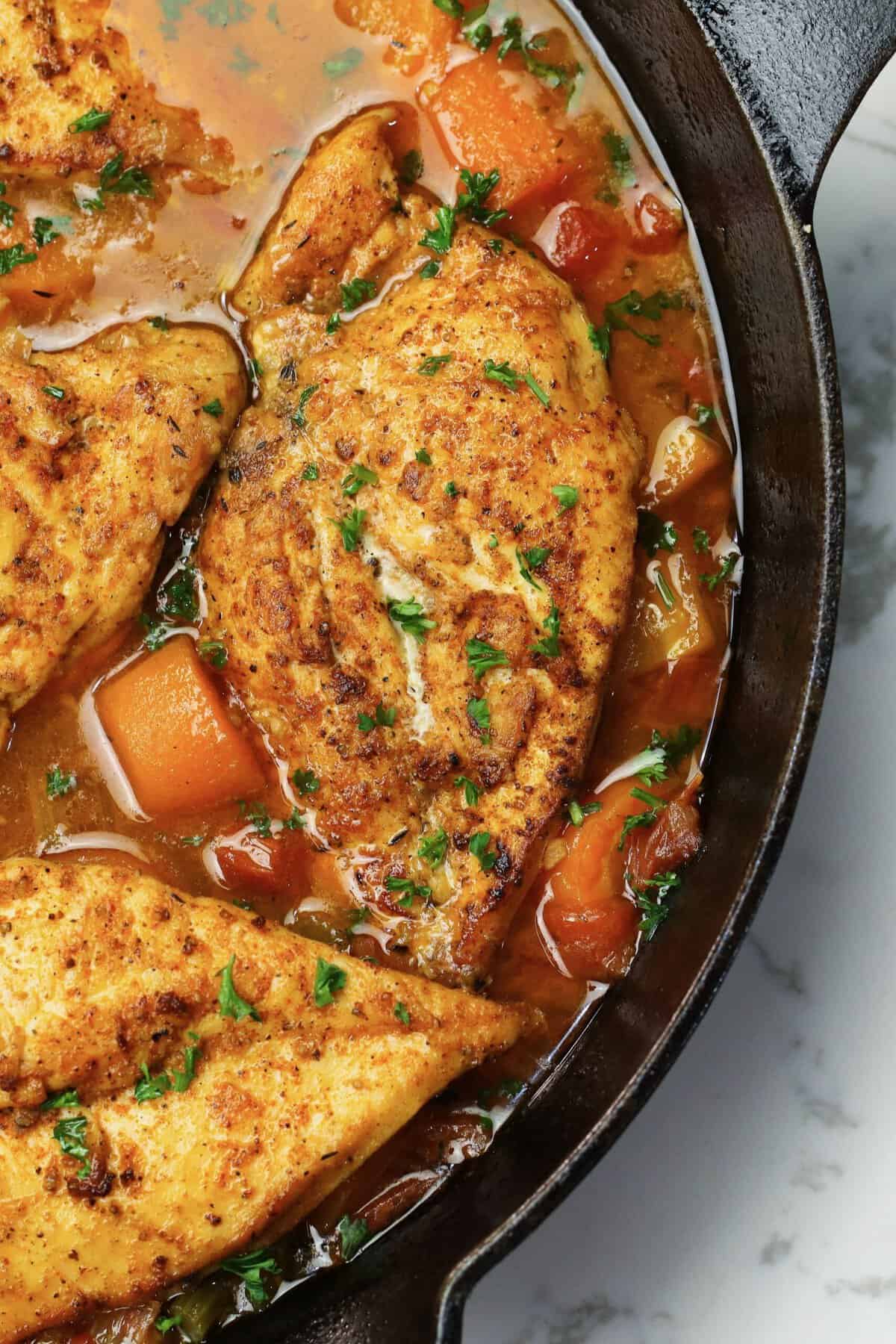 braised chicken breast in skillet