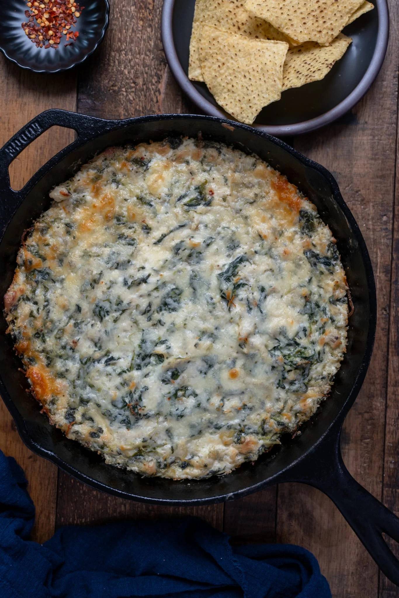spinach artichoke dip in cast iron skillet