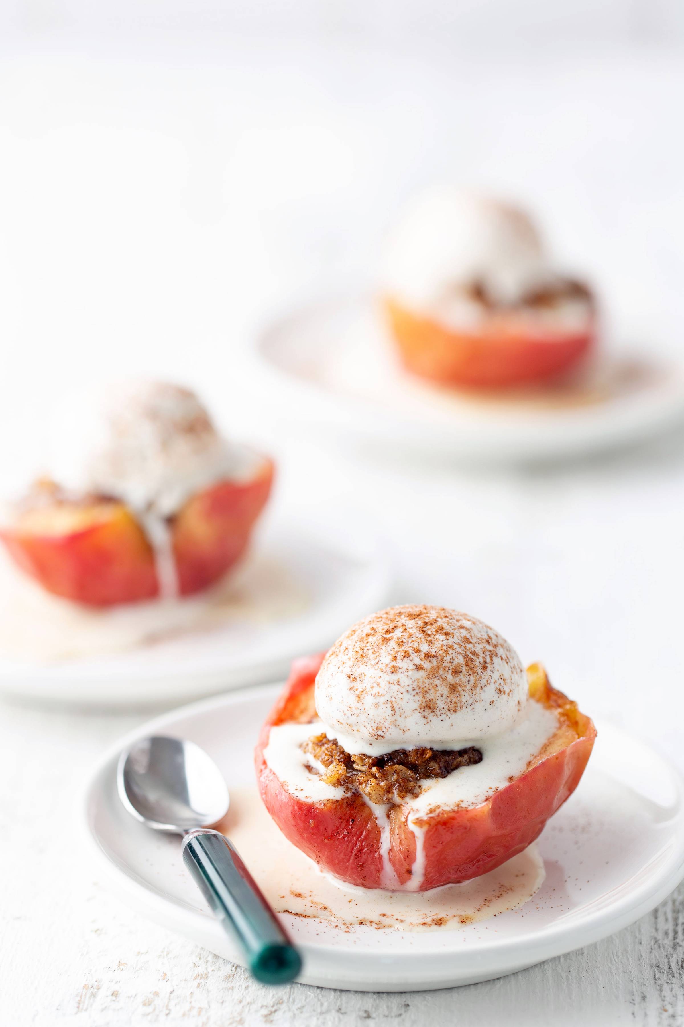 baked apples with ice cream on top