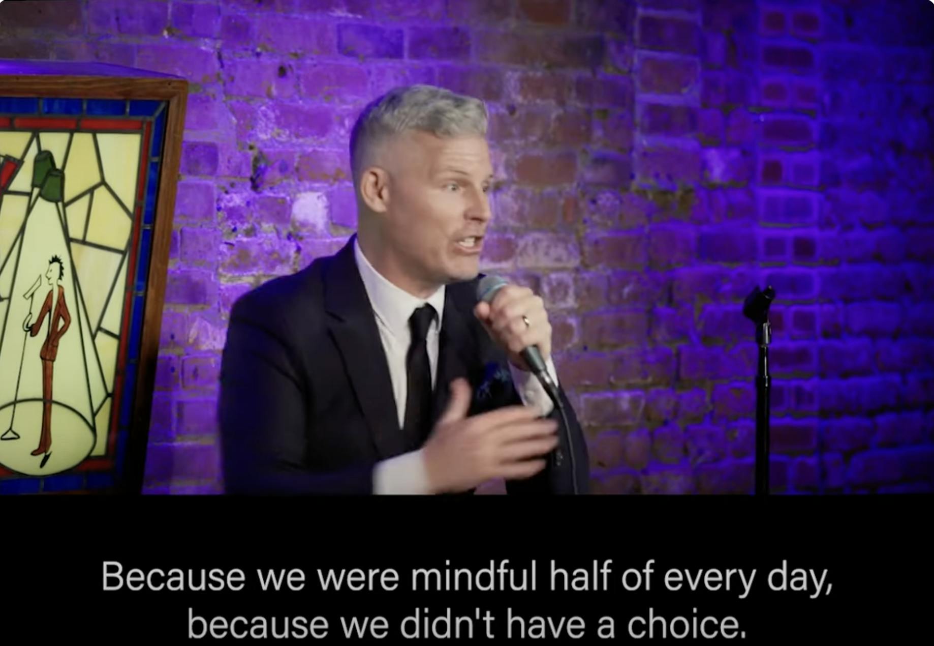 An image of a comedian talking about mindfulness