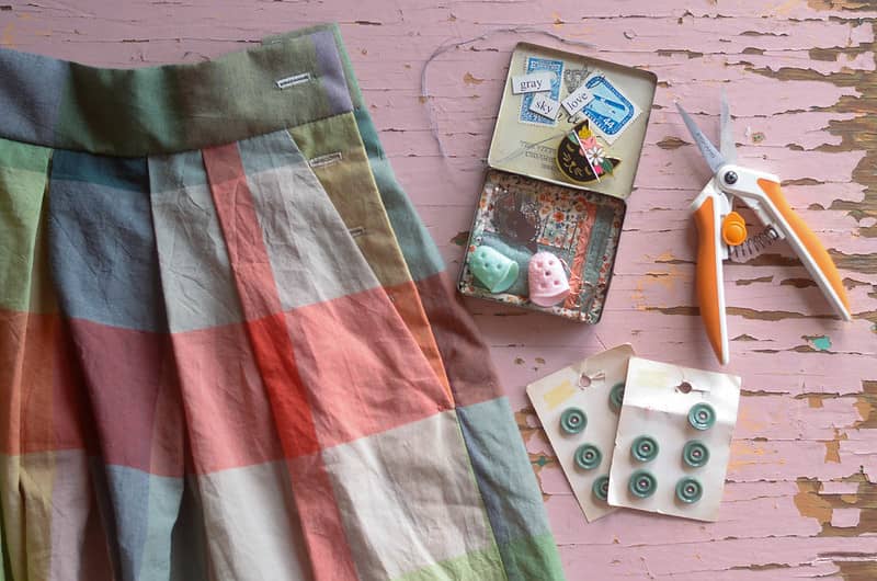 check skirt on a table with buttons and scissors
