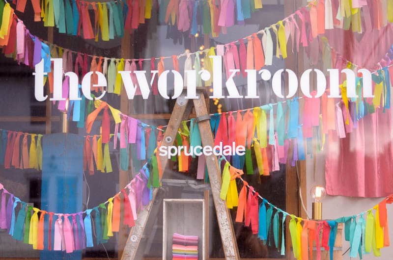the workroom window with colourful fabric bunting