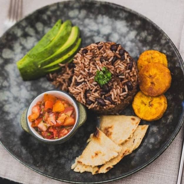 A plate of rice, beans, and plantains.