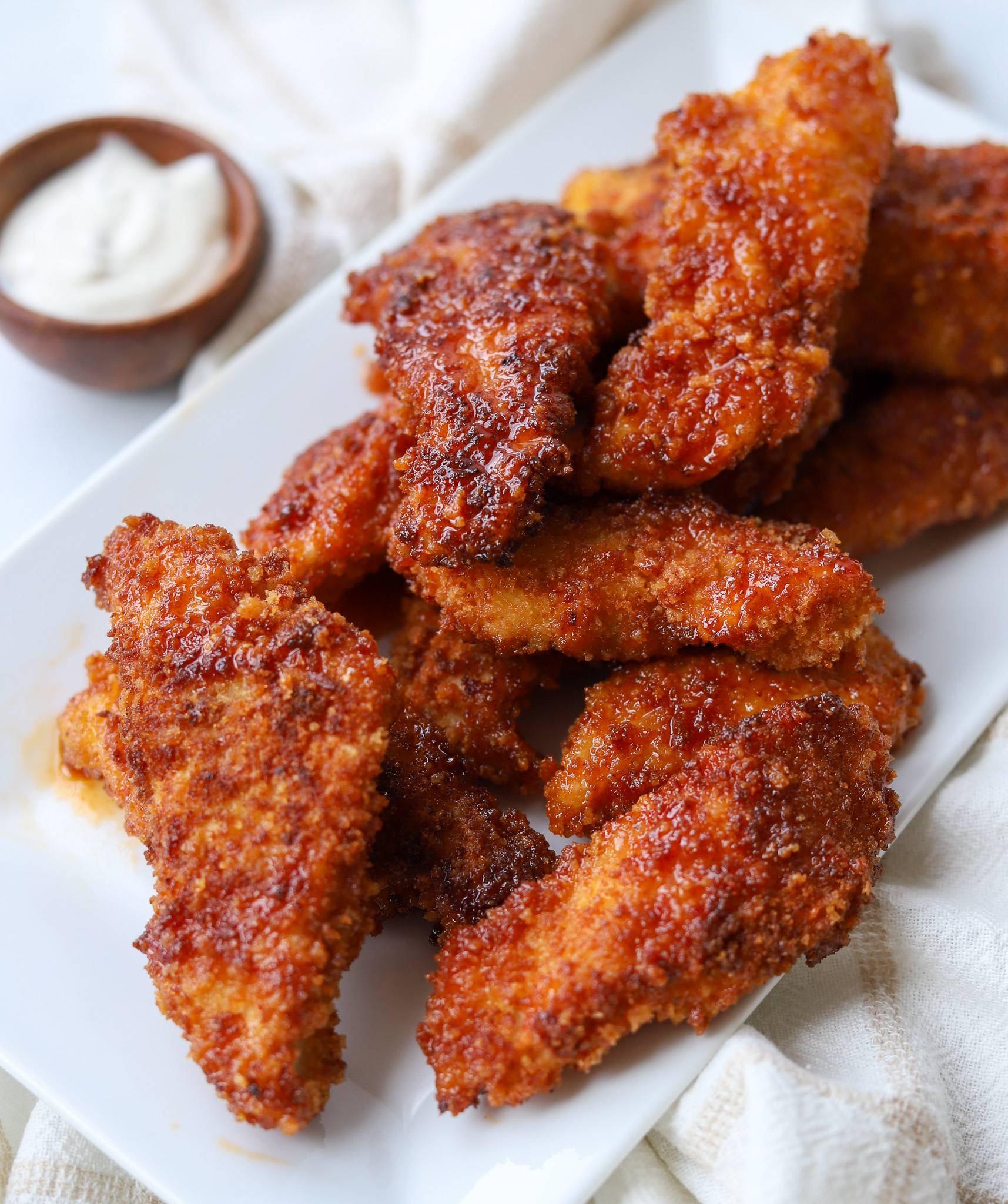 hot honey chicken tenders on plate.