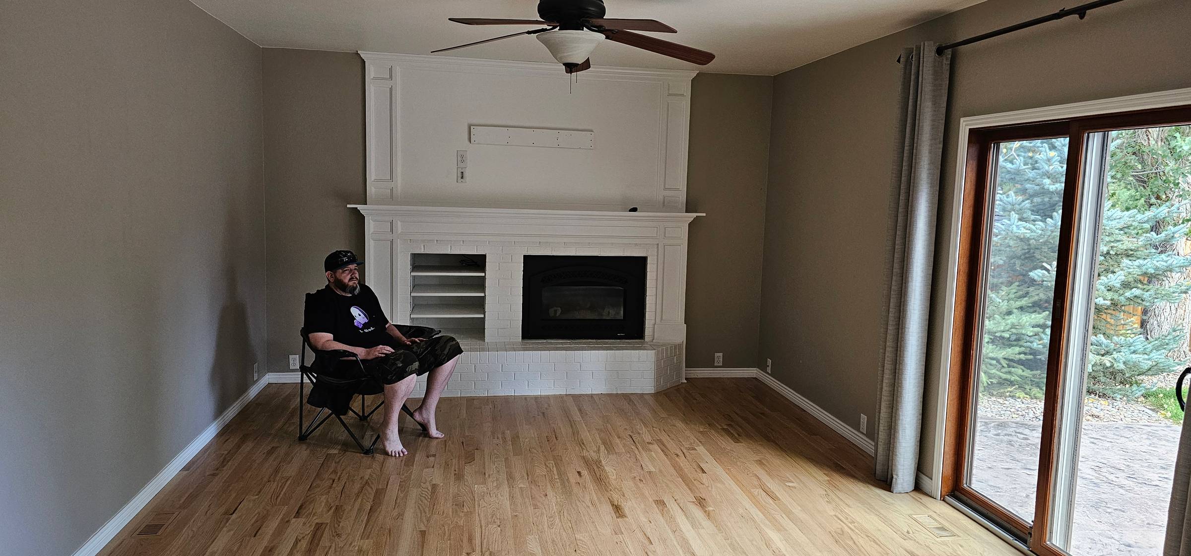 A man sitting in an empty room