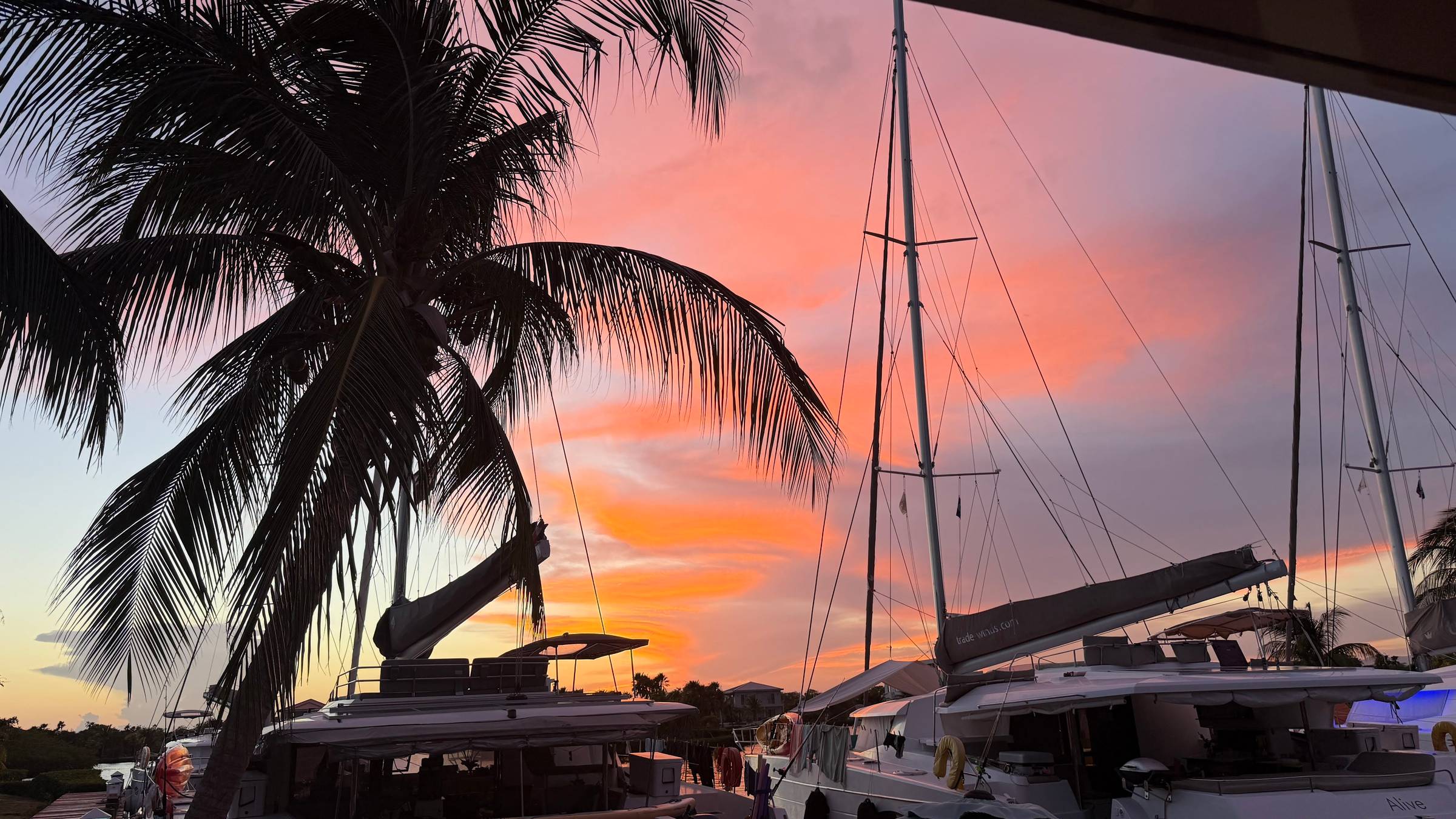 Catamarans at port in Placencia Belize at sunset