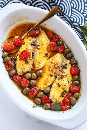 baked fish in a white bowl