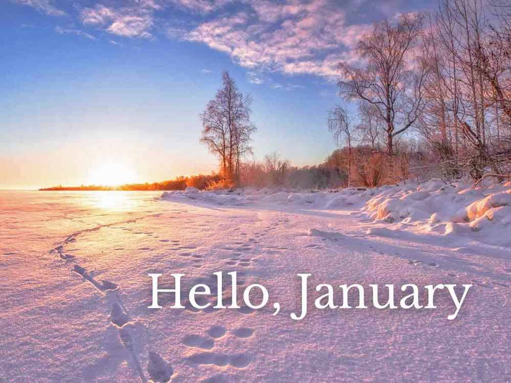 The sun rising over a pretty snowy landscape.