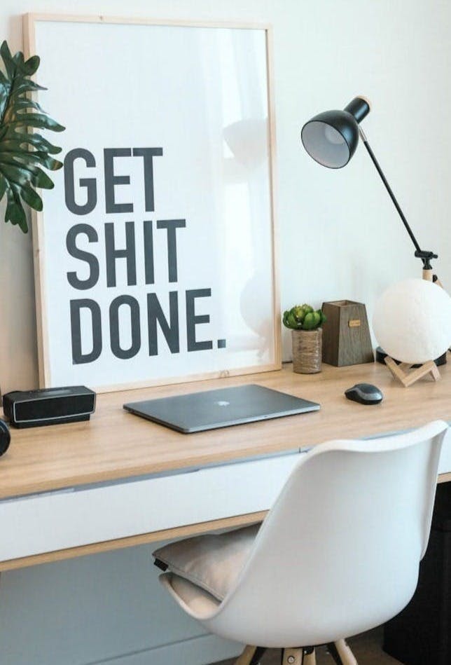 brown and white wooden desk with chair and laptop