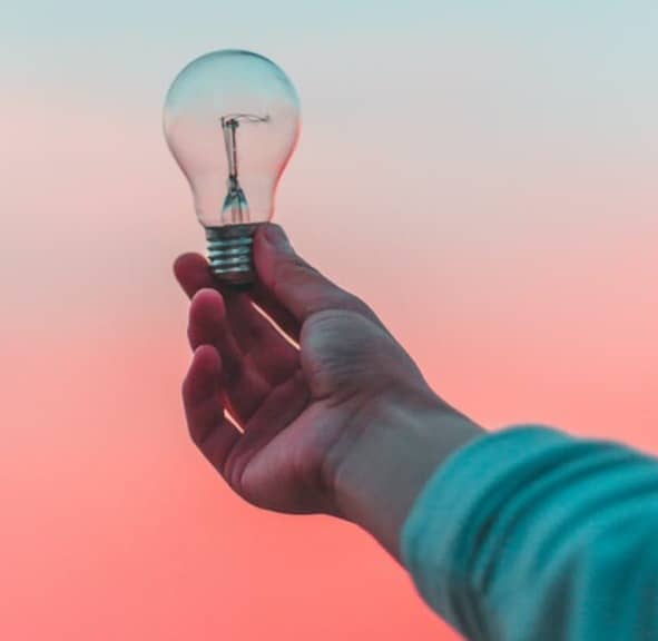 person holding light bulb