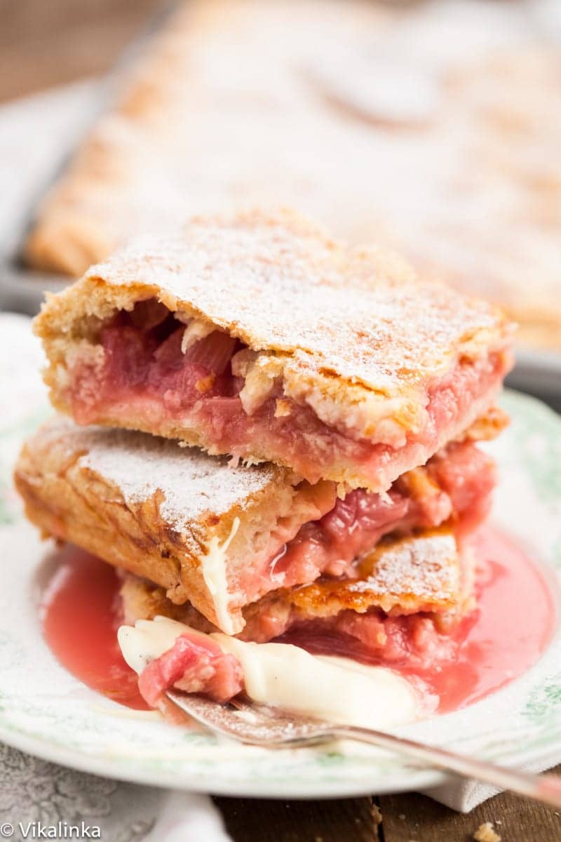 three small pieces of rhubarb slab pie piled on a small plate
