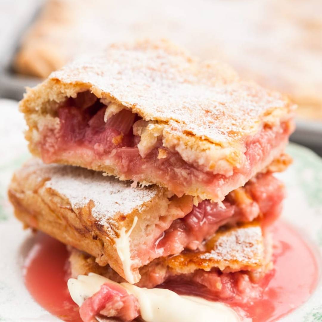 three small pieces of rhubarb slab pie piled on a small plate