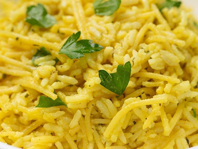closeup image of homemade rice a roni style rice and gf pasta with fresh parsley leaves