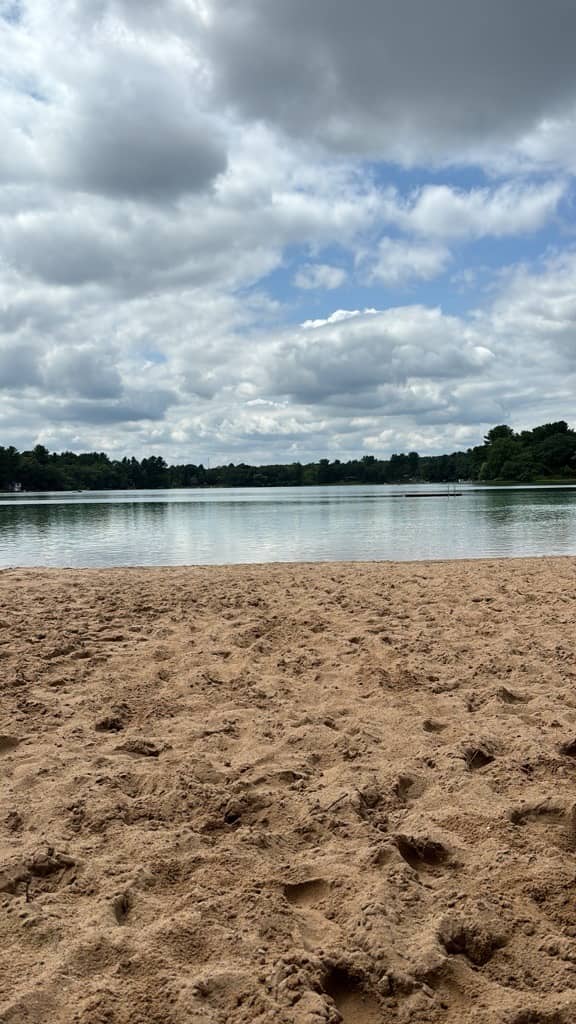 A Peaceful and serene lake front with sand beaches, turquoise waters and blue sky with big puffy white clouds.  You can have this peace when you protect your number one asset in your business.
