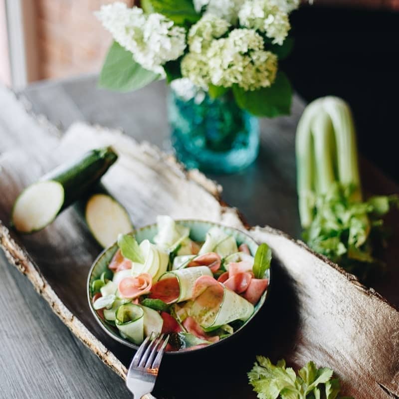 vegetable salad on black ceramic bowl
