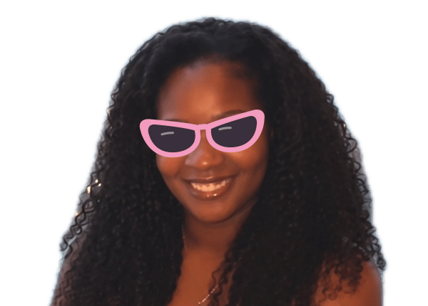 Janeisha smiling in cat-eye sunglasses
