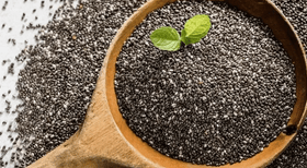 wooden spoon full of the black chia seeds