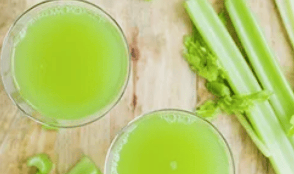 2 glasses full of clelery juice and a stalk of celery on the side