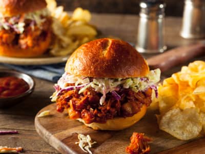 barbecue jackfruit slider on a cutting board with chips