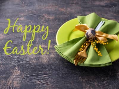green plate with green napkin and gold fork; text: Happy Easter!