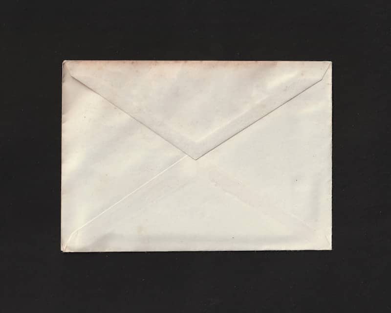 A white envelope on a black background