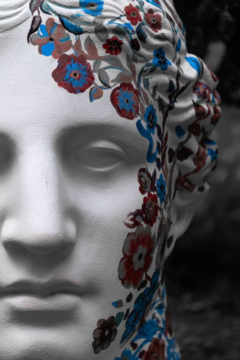 White marble bust with painted floral pattern