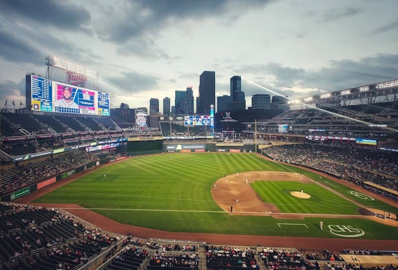 A baseball stadium with a view of the city