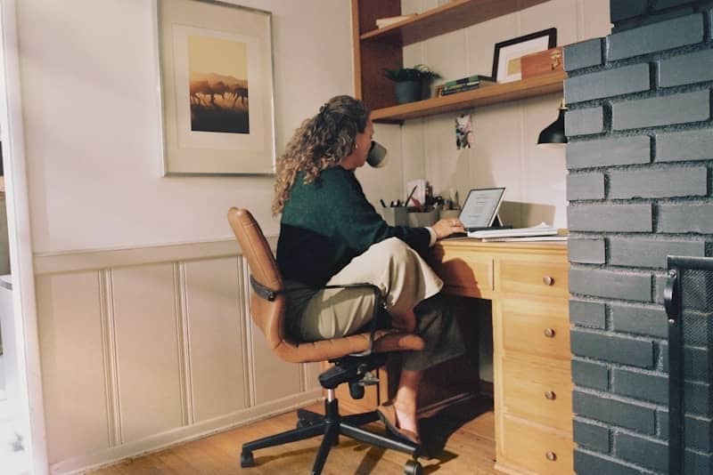 Woman working at desk with coffee