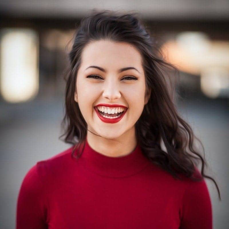 closeup photography of woman smiling
