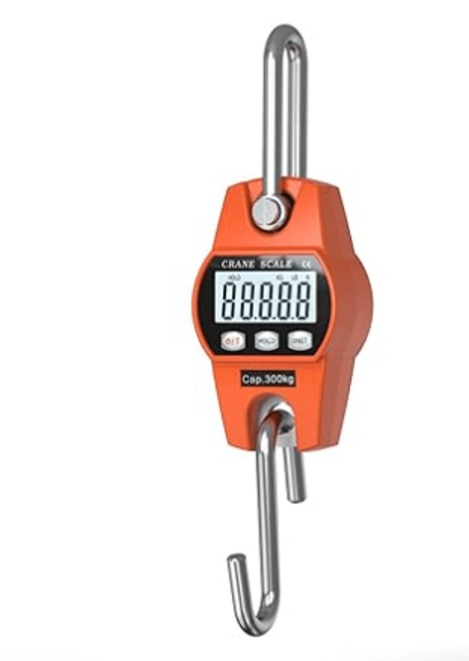 An orange crane scale in a vertical position on a white background