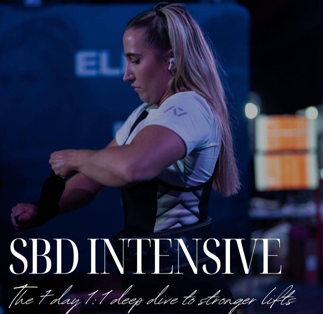A woman with long blonde hair wearing workout attire is shown wrapping her wrist in a dimly lit gym environment. She appears focused and is wearing wireless earbuds. The text overlay reads: 