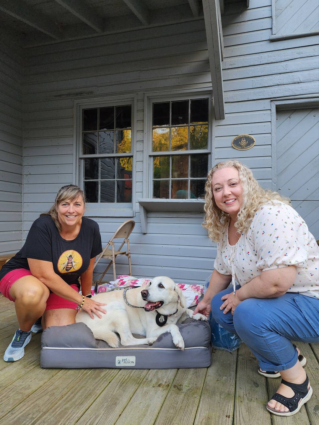 two people with a dog