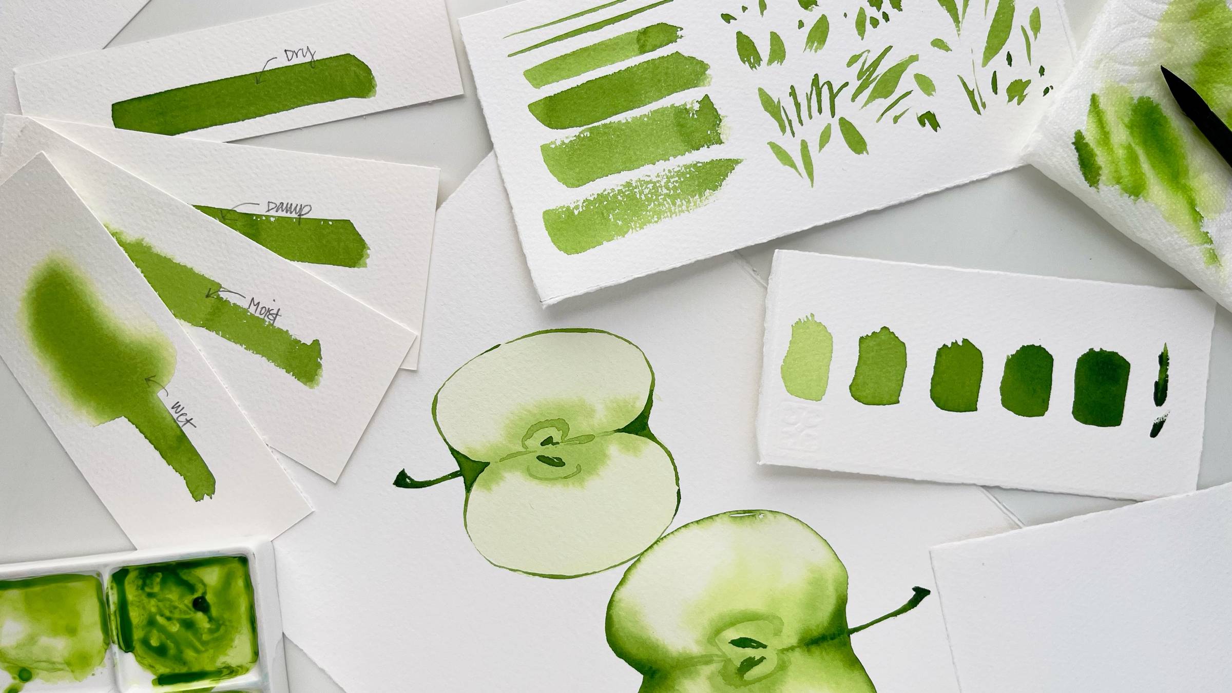 loose sheets of green watercolor painting techniques and strokes
