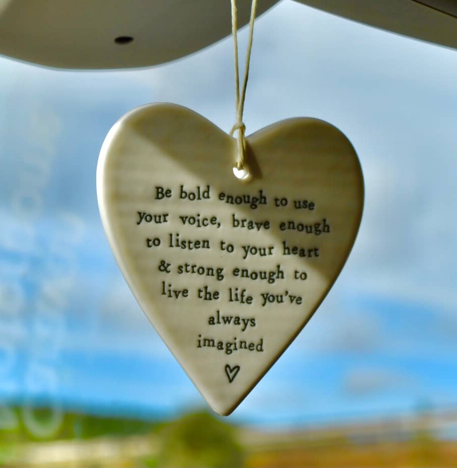 white heart-shaped hanging ornament with inspirational quote