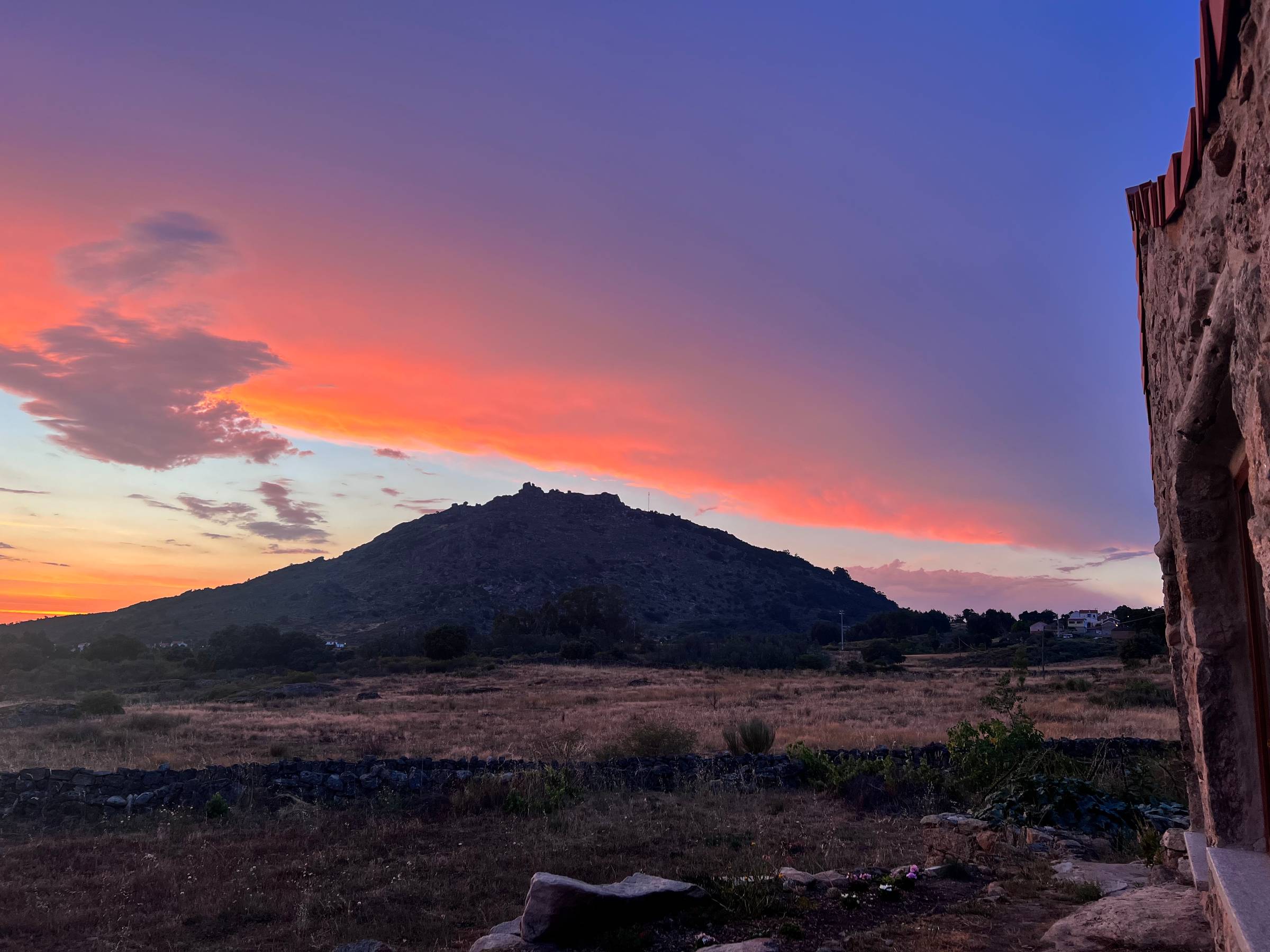 orange and purple cloud with sunset above a mountain