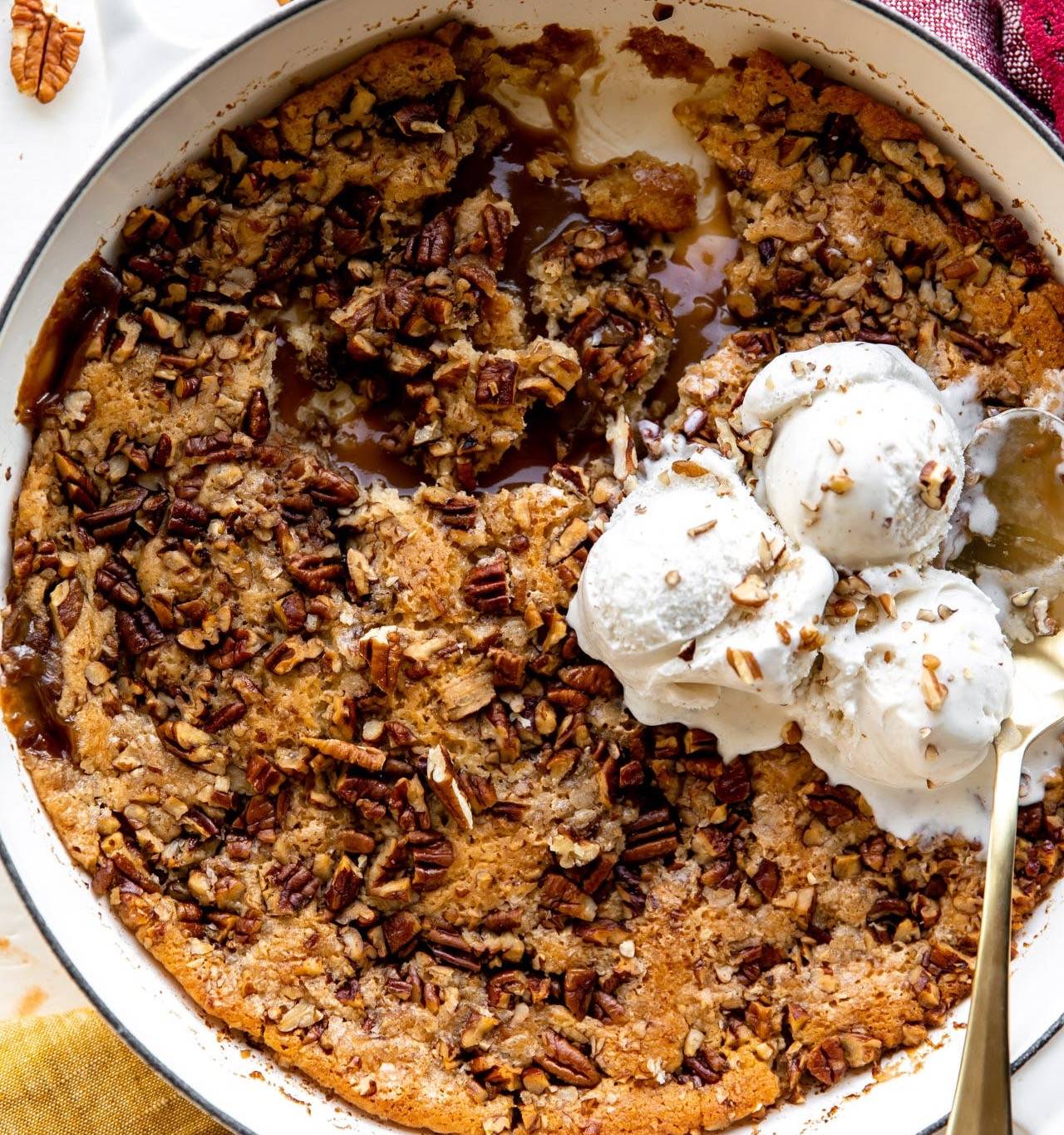 Pecan Cobbler served with ice cream.